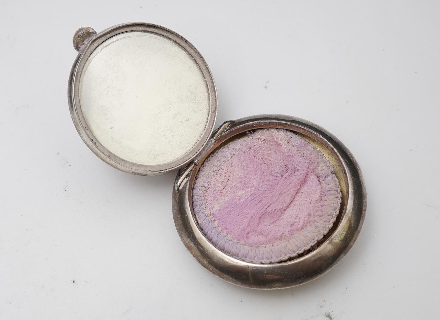 A small group of assorted collectables and jewellery including a Dunhill lighter, 64mm, a George V silver and enamel small compact, silver thimble, two Victorian garnet set brooches, an Edwardian 9ct, amethyst and seed p